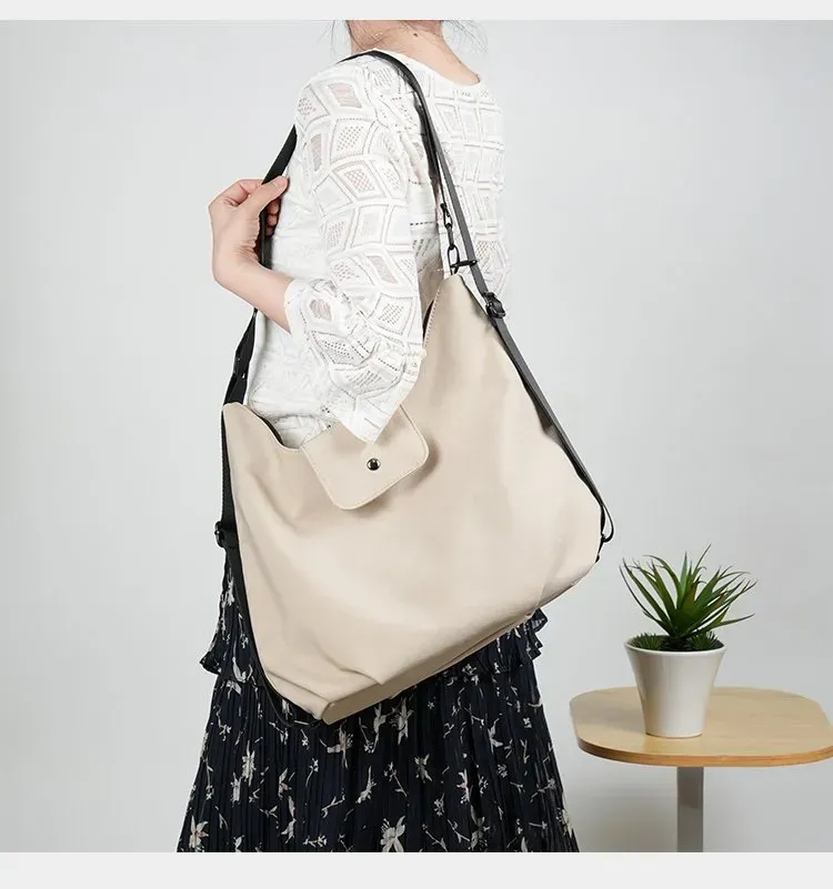 Tas Selempang Wanita Bahan Oxford Polos Model Hobo Tali Panjang Resleting Grosir Import