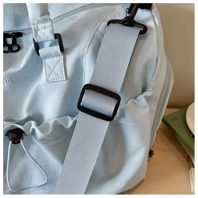 Tas Selempang Wanita Bahan Nylon Polos Warna Biru Bentuk Kotak Tali Panjang untuk Travel