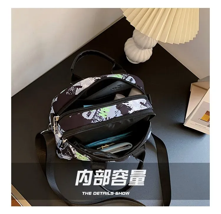 Tas Selempang Wanita Bahan PU Sintetis Motif Print Warna Hitam Bentuk Bulat Tali Grosir Import