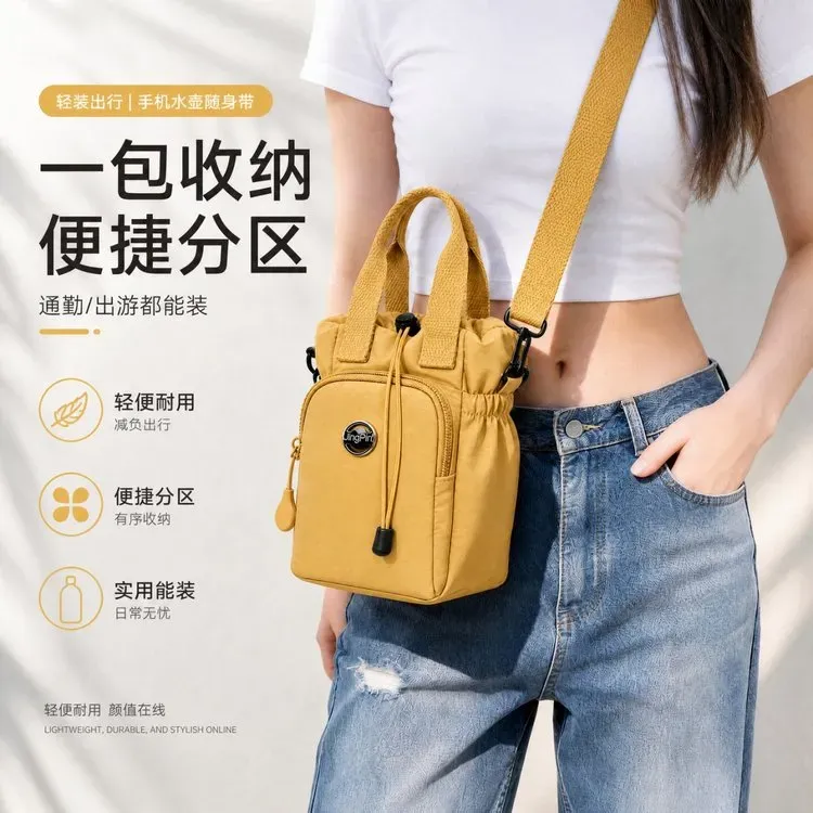 Tas Ransel Wanita Bahan Oxford Motif Grid Warna Hijau Bentuk Bulat Tali Serut Grosir Import