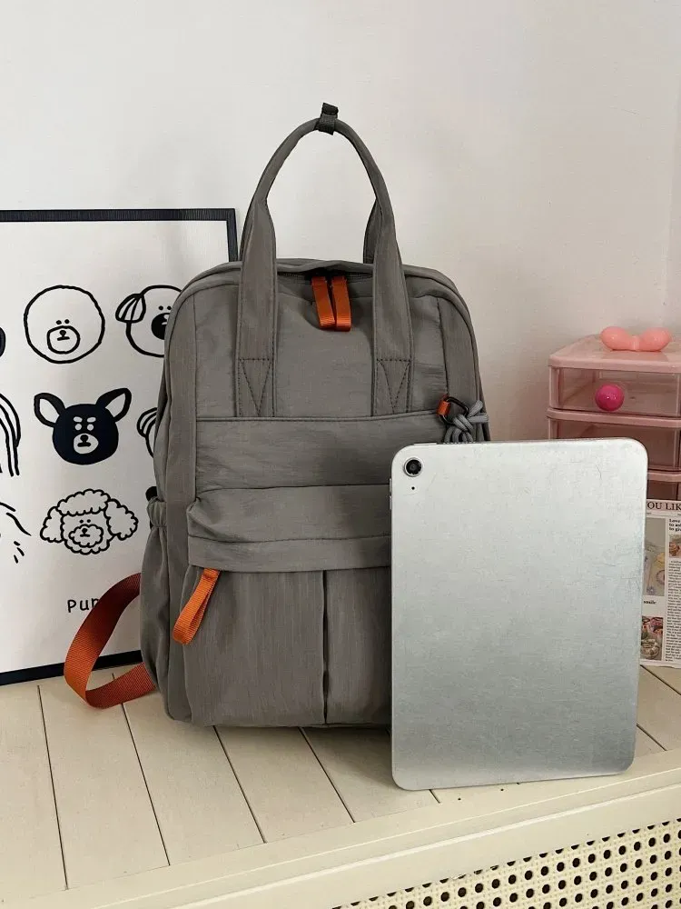 Tas Selempang Wanita Bahan Nylon Polos Warna Abu-Abu Bentuk Kotak Tali Panjang Resleting kategori tas selempang grosir