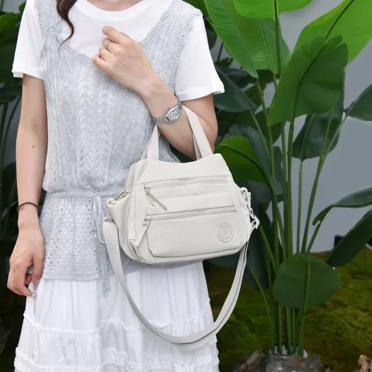 Tas Selempang Wanita Bahan Nylon Polos Warna Ungu Bentuk Kotak Tali Panjang Grosir Import