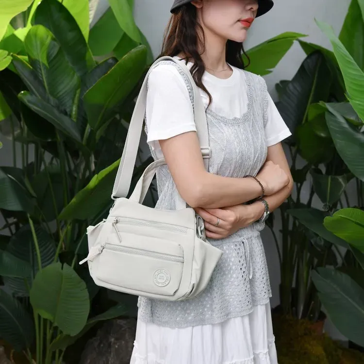 Tas Selempang Wanita Bahan Nylon Polos Warna Ungu Bentuk Kotak Tali Panjang Grosir Import
