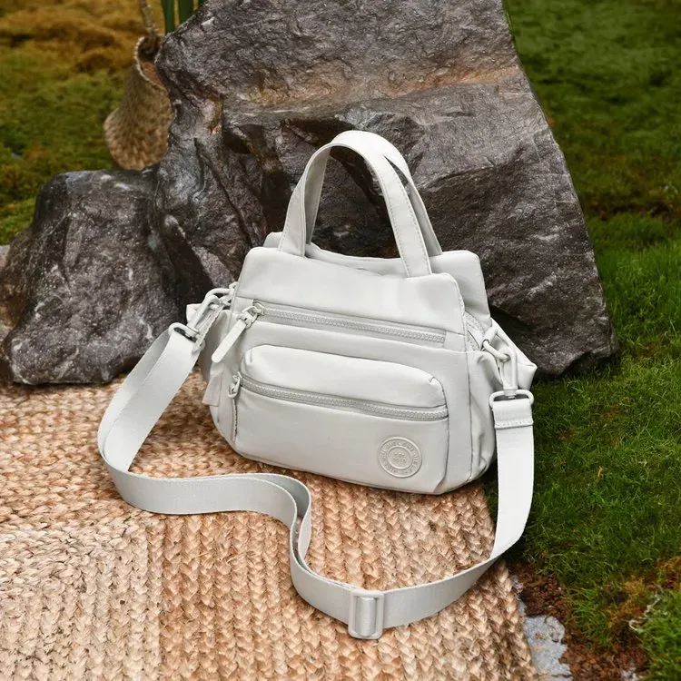 Tas Selempang Wanita Bahan Nylon Polos Warna Ungu Bentuk Kotak Tali Panjang Grosir Import