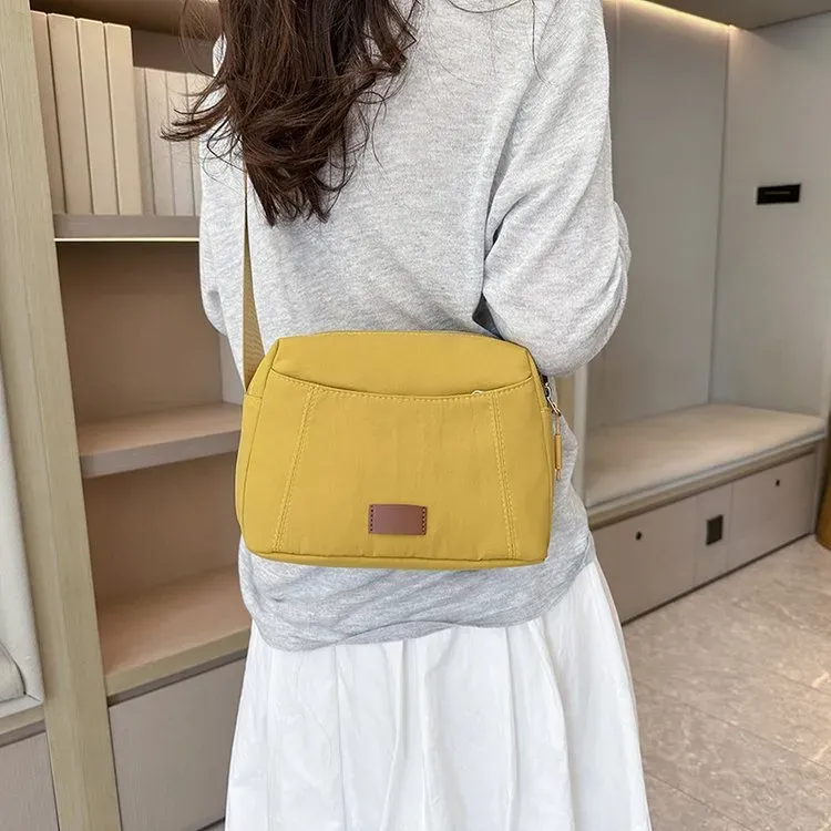 Tas Selempang Wanita Bahan Nylon Polos Warna Kuning Bentuk Kotak Tali Panjang Resleting Grosir