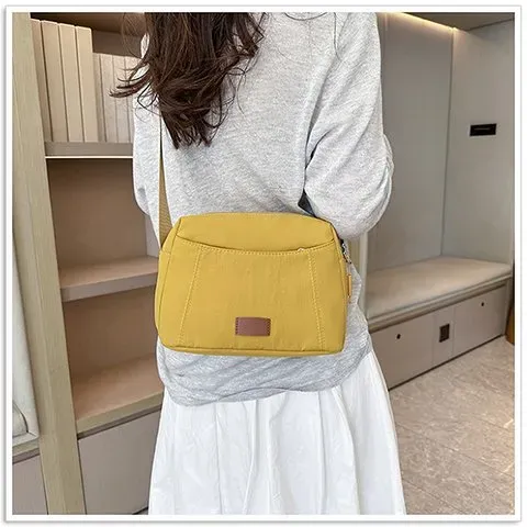 Tas Selempang Wanita Bahan Nylon Polos Warna Kuning Bentuk Kotak Tali Panjang Resleting Grosir