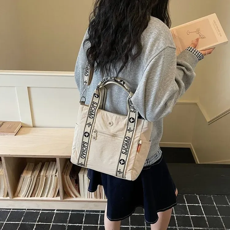 Tas Selempang Wanita Bahan Nylon Motif Print Warna Biru Bentuk Kotak Tali Lebar Grosir Import