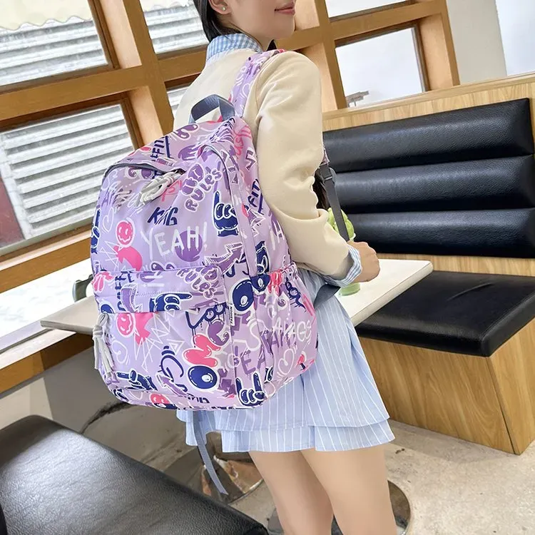 Tas Ransel Wanita Bahan Nylon Motif Floral Warna Hitam Resleting Grosir Import