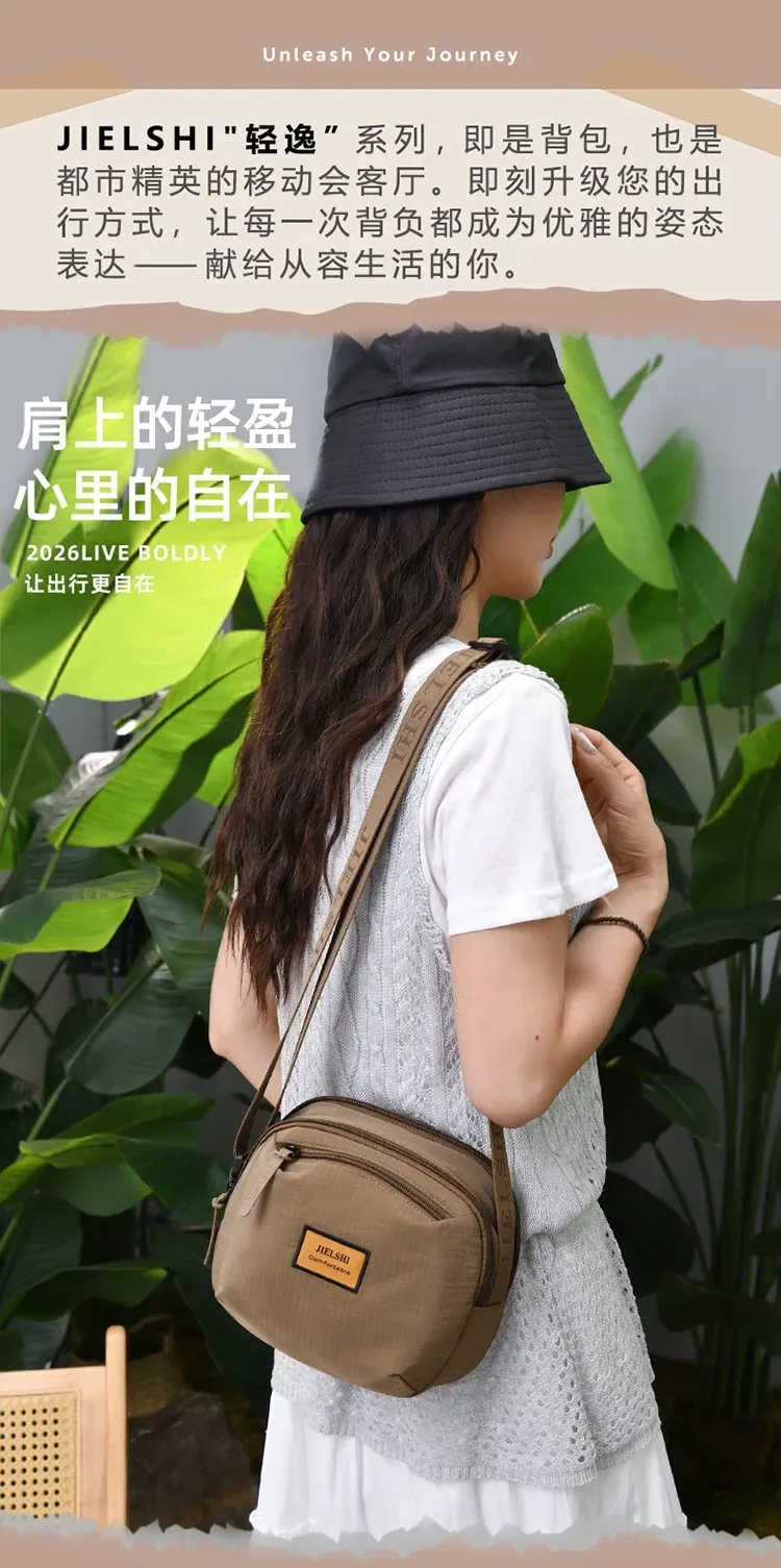Tas Selempang Wanita Bahan Nylon Polos Bentuk Bulat Tali Panjang Resleting Grosir Import
