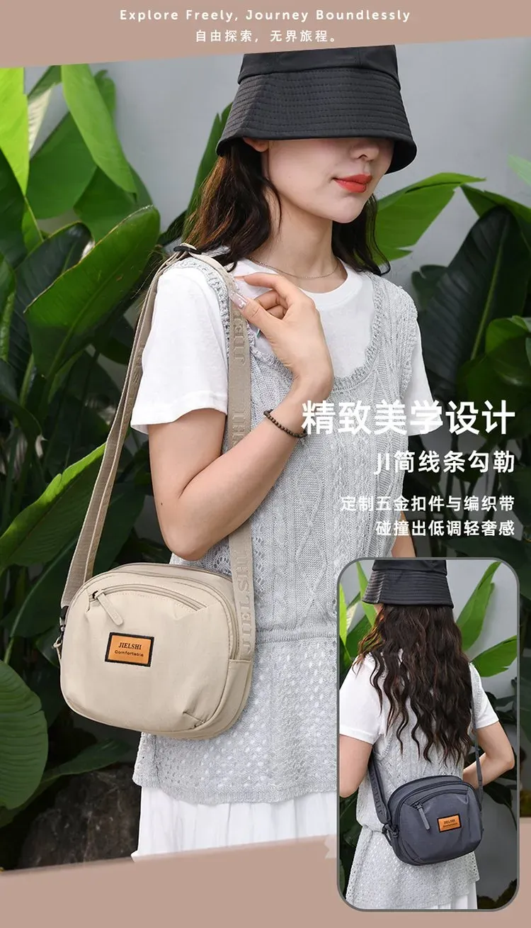 Tas Selempang Wanita Bahan Nylon Polos Bentuk Bulat Tali Panjang Resleting Grosir Import