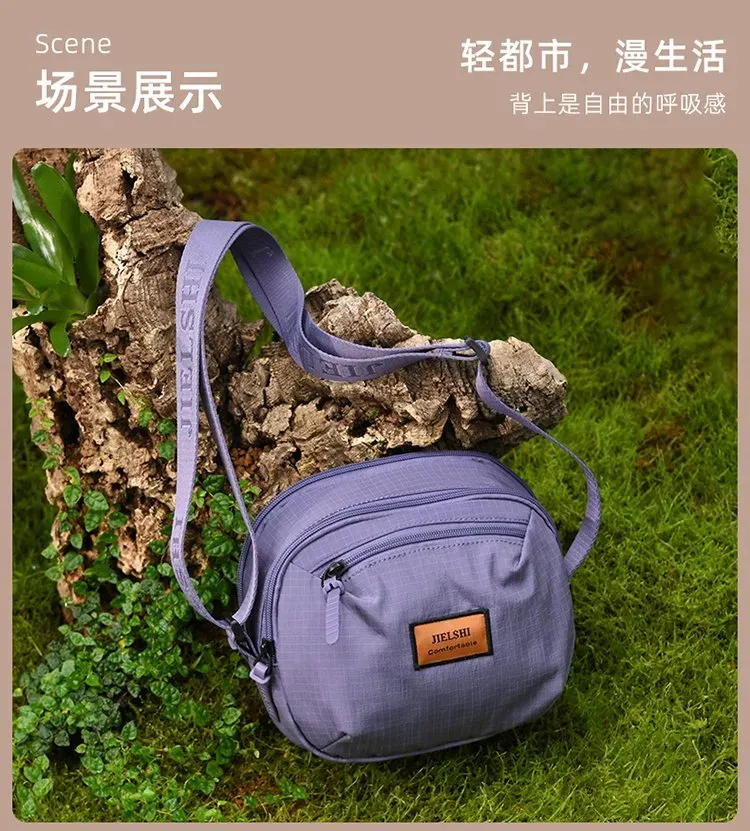 Tas Selempang Wanita Bahan Nylon Polos Bentuk Bulat Tali Panjang Resleting Grosir Import