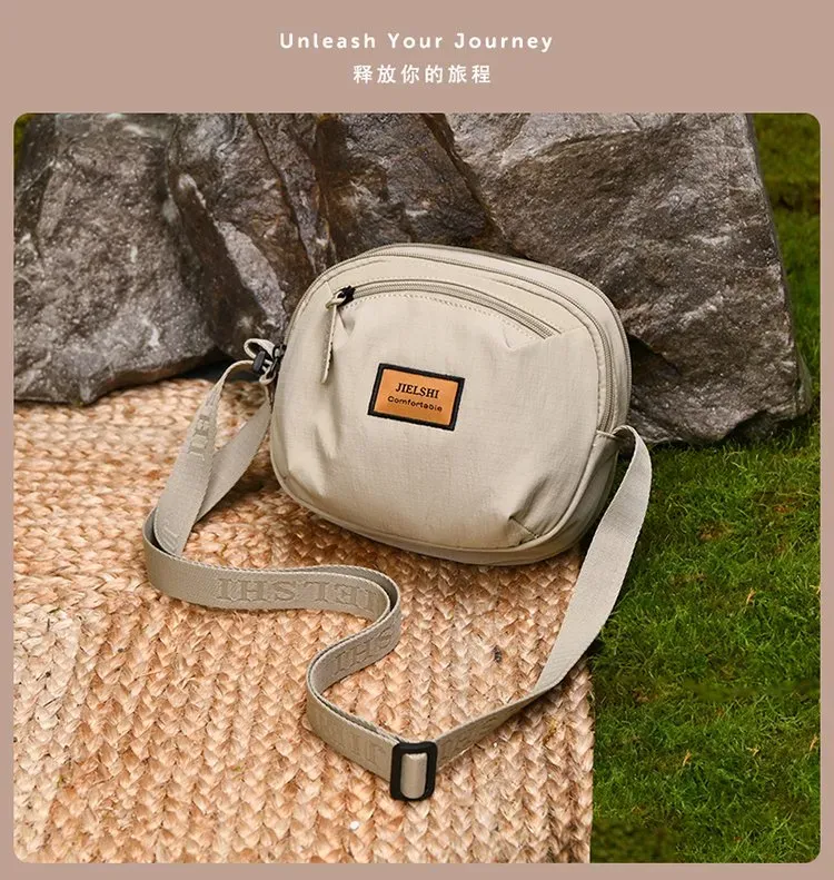 Tas Selempang Wanita Bahan Nylon Polos Bentuk Bulat Tali Panjang Resleting Grosir Import