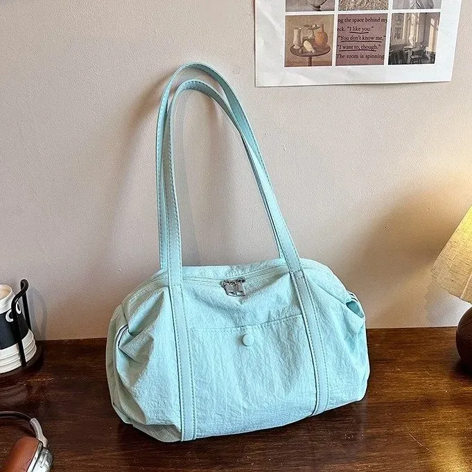 Tas Selempang Wanita Bahan Nylon Polos Warna Biru Bentuk Bulat Tali Lebar Grosir Import kategori tas selempang grosir