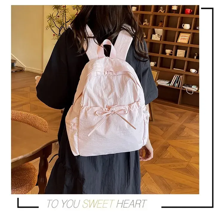 Tas Ransel Wanita Bahan Nylon Polos Warna Pink Bentuk Kotak Tali Lebar Resleting Motif Print kategori tas ransel grosir
