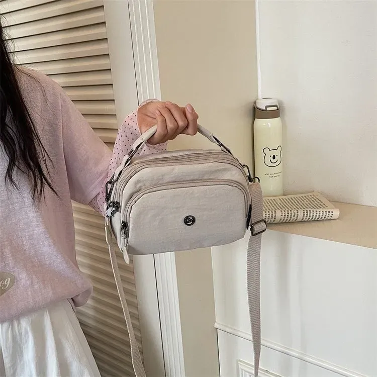 Tas Selempang Wanita Bahan Nylon Polos Warna Beige Model Hobo Tali Lebar Grosir Import