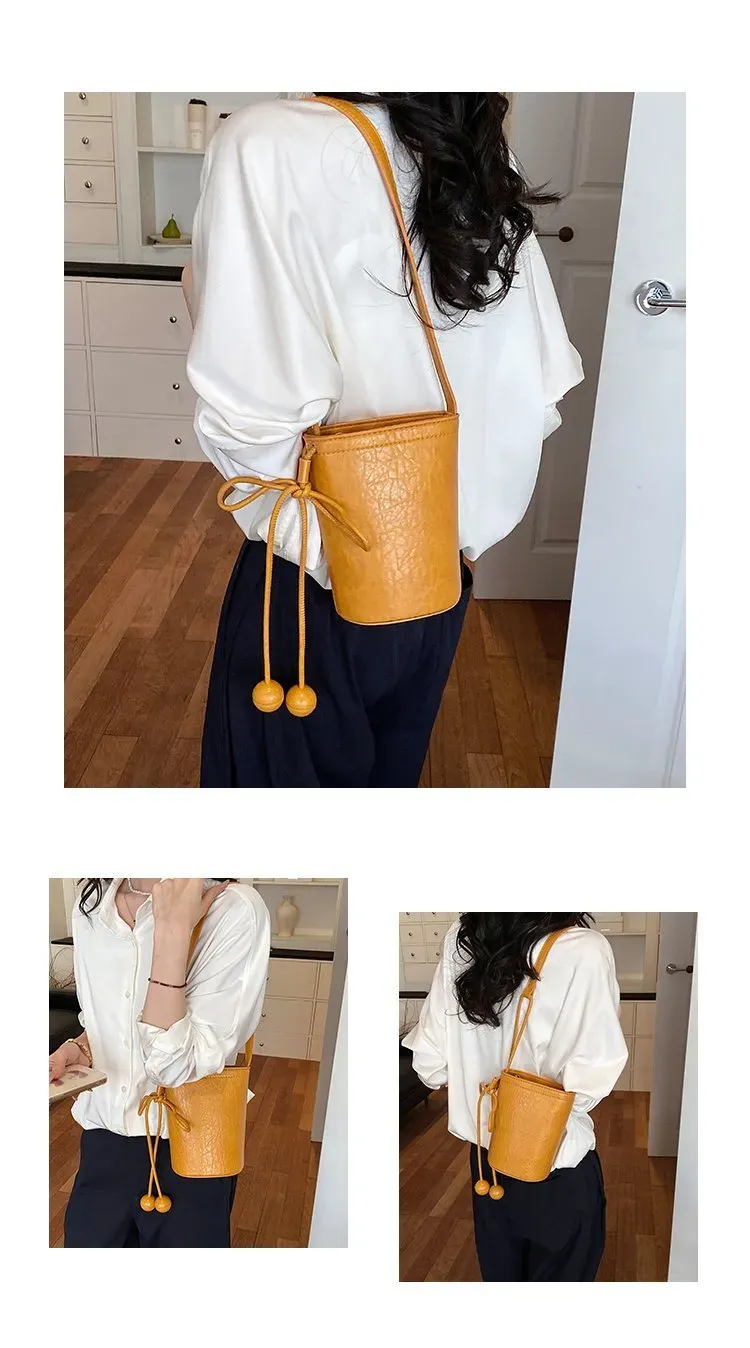 Tas Bucket Wanita Bahan PU Sintetis Polos Warna Hitam Bentuk Bucket Tali Panjang Model Import