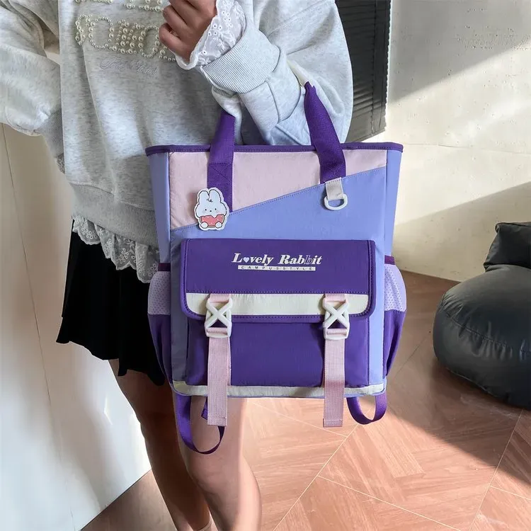 Tas Ransel Wanita Bahan Nylon Polos Warna Ungu Bentuk Kotak Tali Panjang Grosir Import