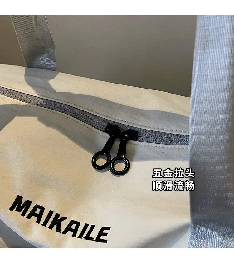 Tas Selempang Wanita Bahan Nylon Polos Warna Ungu Bentuk Kotak Tali Panjang untuk Travel