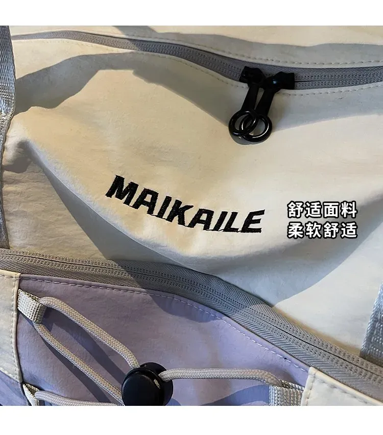 Tas Selempang Wanita Bahan Nylon Polos Warna Ungu Bentuk Kotak Tali Panjang untuk Travel