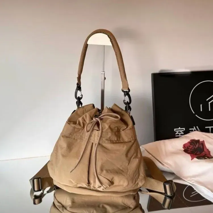 Tas Bucket Wanita Bahan Nylon Polos Warna Cokelat Bentuk Bucket Tali Panjang Grosir Import