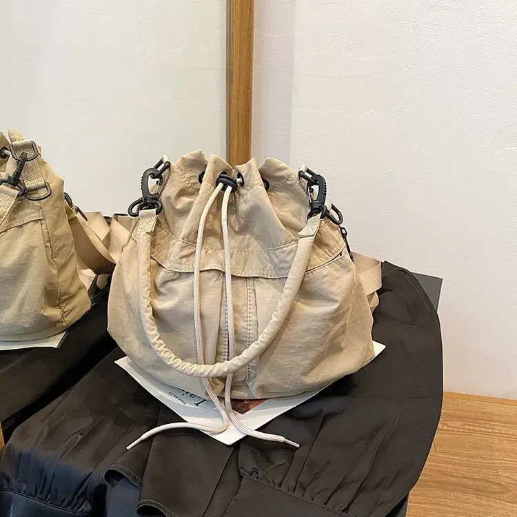 Tas Bucket Wanita Bahan Nylon Polos Warna Cokelat Bentuk Bucket Tali Panjang Grosir Import