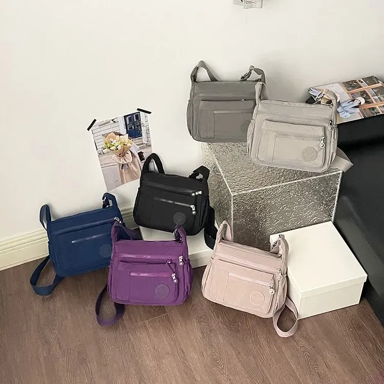 Tas Selempang Wanita Bahan Nylon Polos Warna Hitam Bentuk Kotak Tali Lebar Stok Grosir