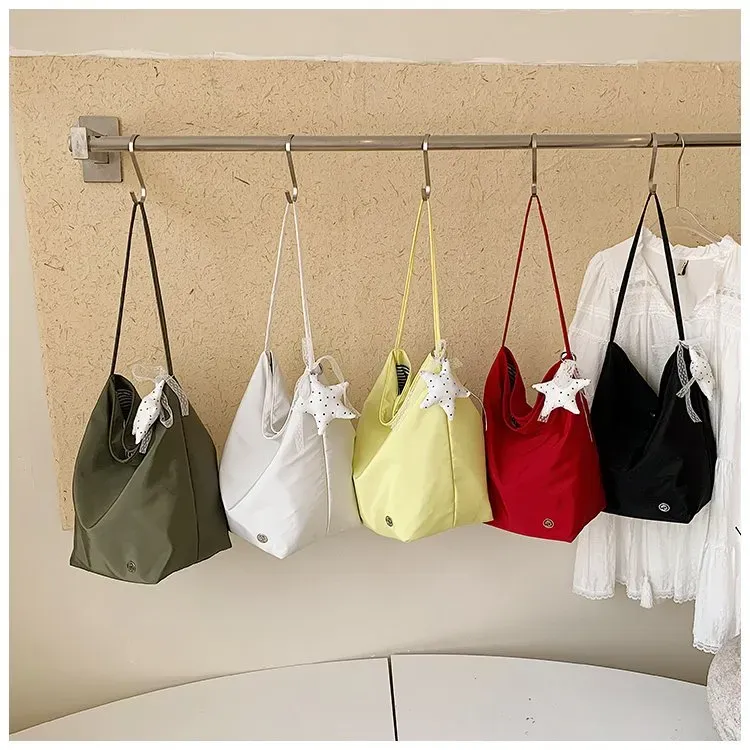 Tas Selempang Wanita Bahan Nylon Polos Warna Merah Bentuk Bulat Tali Panjang Grosir Import
