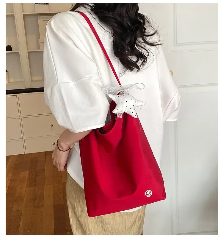 Tas Selempang Wanita Bahan Nylon Polos Warna Merah Bentuk Bulat Tali Panjang Grosir Import