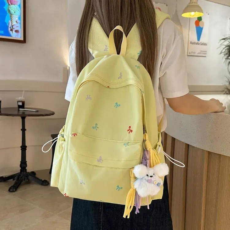 Tas Ransel Wanita Bahan Oxford Motif Print Warna Kuning Bentuk Kotak Tali Lebar Grosir Import