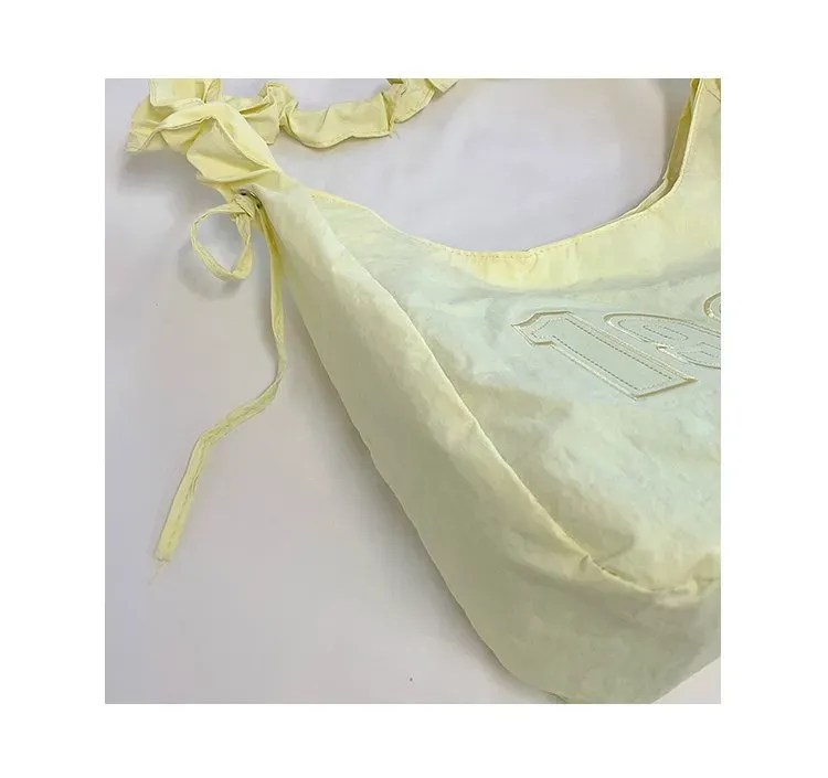 Tas Selempang Wanita Bahan Nylon Polos Warna Kuning Model Hobo Tali Serut Model Grosir Import