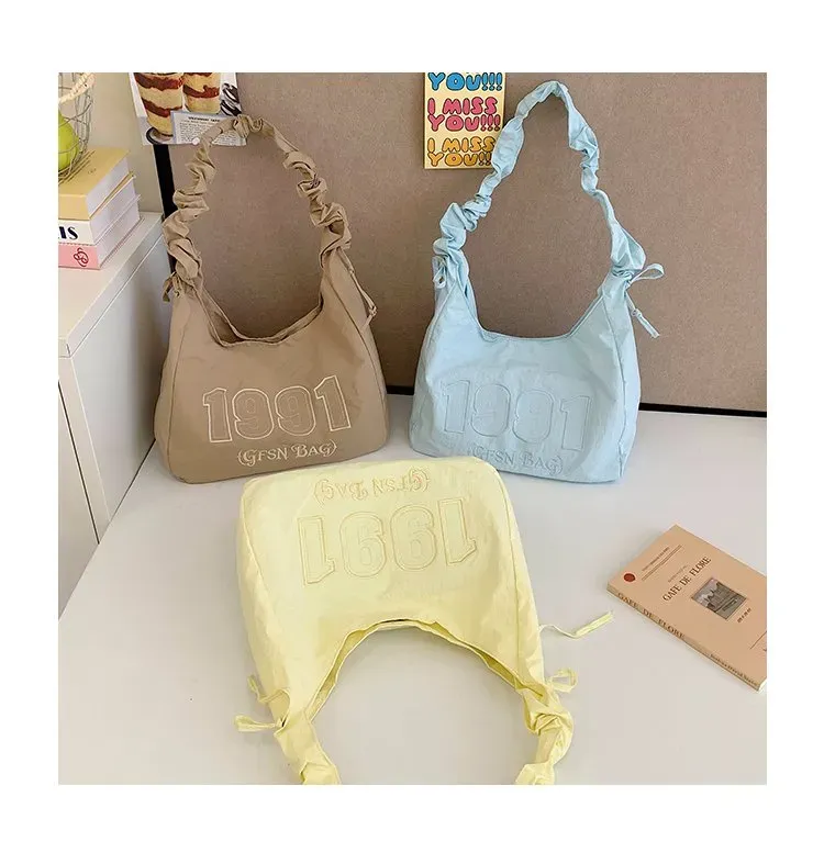 Tas Selempang Wanita Bahan Nylon Polos Warna Kuning Model Hobo Tali Serut Model Grosir Import