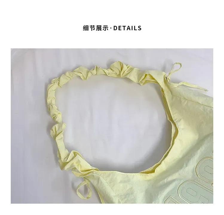 Tas Selempang Wanita Bahan Nylon Polos Warna Kuning Model Hobo Tali Serut Model Grosir Import