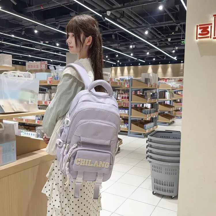 Tas Ransel Wanita Bahan Nylon Polos Warna Ungu Bentuk Kotak Tali Lebar Resleting Motif Floral