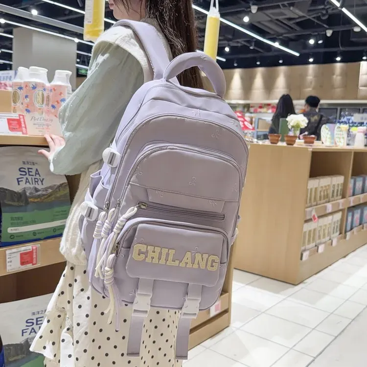 Tas Ransel Wanita Bahan Nylon Polos Warna Ungu Bentuk Kotak Tali Lebar Resleting Motif Floral