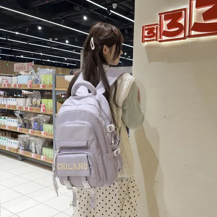 Tas Ransel Wanita Bahan Nylon Polos Warna Ungu Bentuk Kotak Tali Lebar Resleting Motif Floral